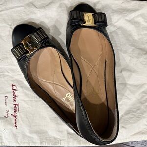 Salvatore Ferragamo Black Flats with Gold Bow Accent